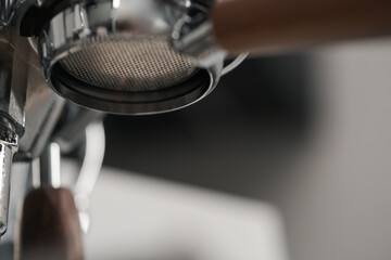 Closeup detail shot of coffee machine with walnut wood handles