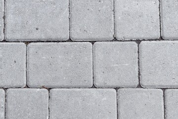 Obraz premium Grey pavement outdoors. Greybricks texture. Urban concept.