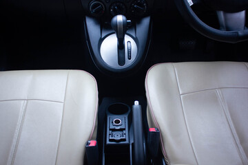 automatic transmission shift selector in the car interior. Closeup a manual shift of modern car gear shifter.