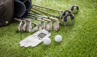 Fototapete Rund Golf equipment on green grass golf course, close up view. © Rawf8