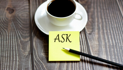 Business ASK . Yellow stickers with text on wooden background with coffee