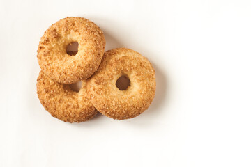 Top view. Round, freshly baked shortbread biscuits with sugar sprinkles stacked together isolated...
