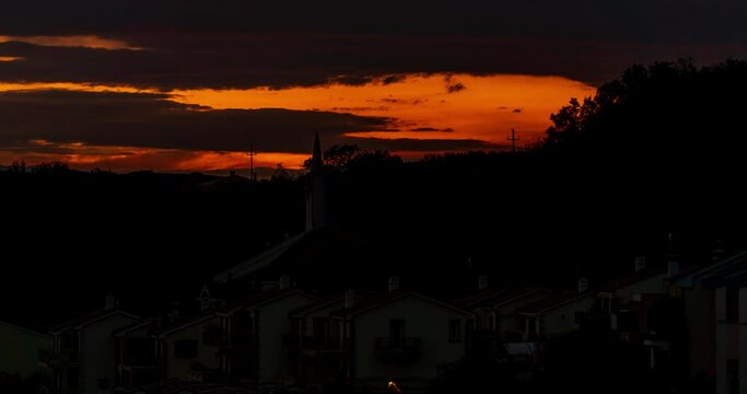4K Sunrise Timelapse Sky Clouds Morning Village Scenic Nature Golden Light Video. Beautiful Rooftops and Tranquil Dawn Atmosphere over Residential Houses