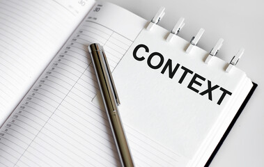 text CONTEXT on the short note texture background with pen