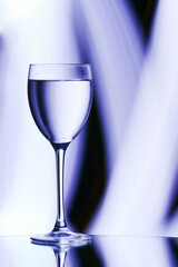 beautiful wine glass with a drink on the table