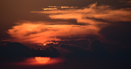 the fiery sun setting down