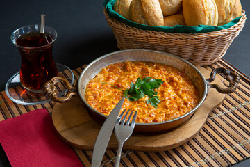 sausage with egg in copper pan turkish meal