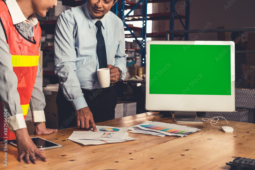 Poster computer with green screen display in warehouse storage room . delivery and transportation software 
