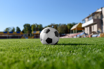 Soccer ball on the green grass of the soccer field.