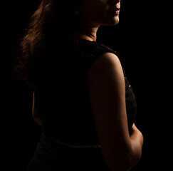 Abstract silhouette of young pretty woman looking away. Profile view.