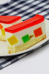 Delicious cheesecake with colorful jelly pieces
