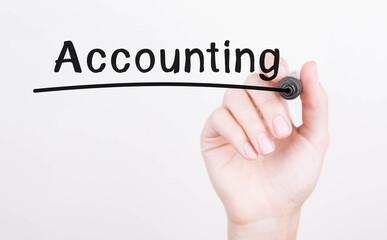 Hand writing Accounting with black marker on transparent wipe board