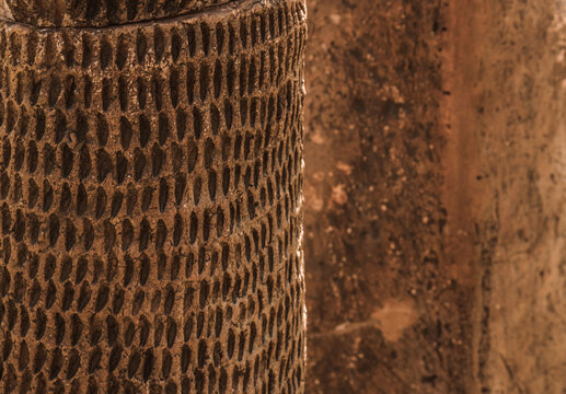 Clay fractal on the clay wall background on a sunny day.