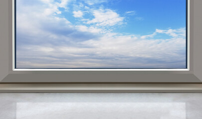 windowsill standing in front of view cloudy sky.