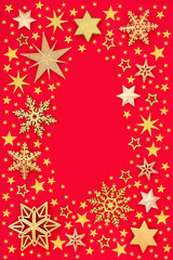 Christmas border with gold stars & snowflakes on red background. Abstract design for Xmas New Year & the festive season. Flat lay top view.