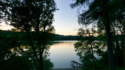 Sunset on a lake with pontoon
