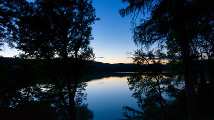 Sunset on a lake with pontoon