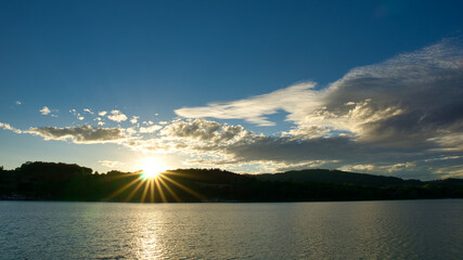 Sunset on a lake with clouds