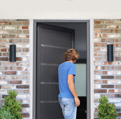 Man opening the door of her home.Inviting the guests