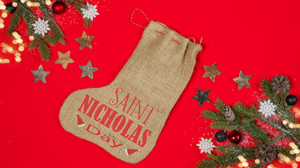 Merry Saint Nicholas Day - Top view / above view from nicholas stocking jute / sock sack, fir...