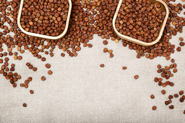 Full plates with legumes bean seed gray peas on wooden background with copy space. Healthy eating. Rustic style. Traditional Latvian product.