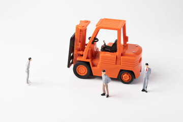 Miniature people: business man and goods transport vehicle. Working concept of transport.