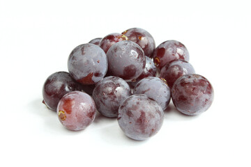 Group of dark wet grapes isolated on white background
