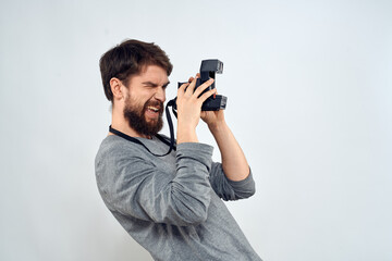 Fototapeta premium photographer with camera hobby technology studio lifestyle creative light background