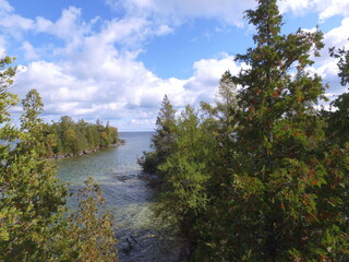 View of Georgian Bay Lake Waters framed by Juniper and Cedar Trees on Shoreline