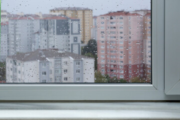 windowsill and Falling rain drops background