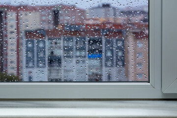 windowsill and Falling rain drops background