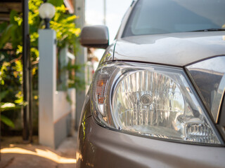 Fototapeta premium A picture of a golden bronze car headlight. With copy space