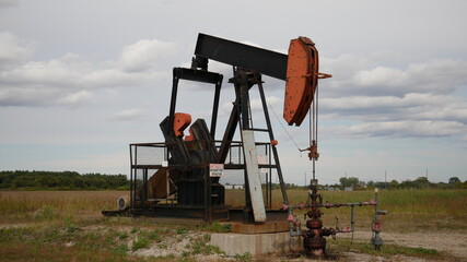 Old rusty oil pump pointing down