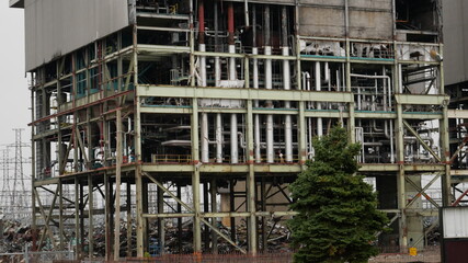 Industrial powerplant structure being demolished and in decay