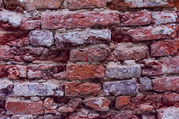Walls that have weathered until red brick.