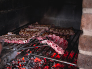 pork ribs on smouldering embers