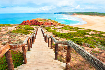 Fototapeta na wymiar Beautiful shore of Atlantic ocean and stairs to the beach. Algarve, Portugal. Famous travel destination