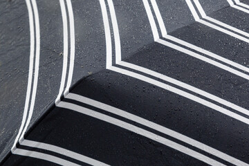 close up falling rain drops on umbrella