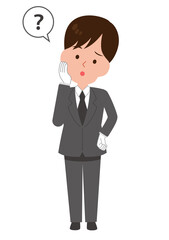 質問しているスーツ姿の男性スタッフ