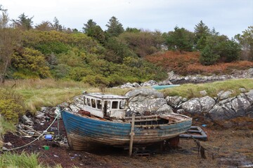 old boat on the river, north uist, hebrides, scotland