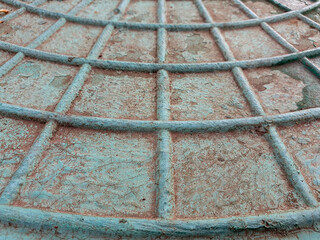 Cobweb pattern on the metal hatch.