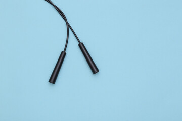 Skipping rope handles on a blue background. Top view