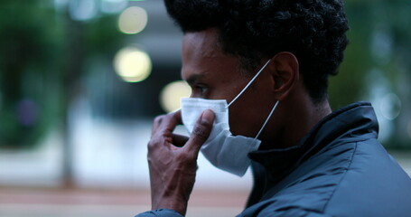 African black man wearing covid -19 face mask outside