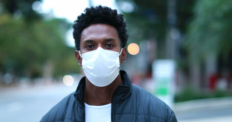 African black man wearing covid -19 face mask outside