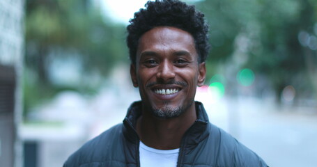 Young black African man portrait outside in city