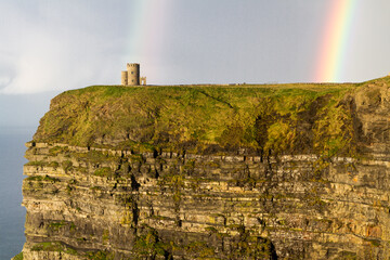 castle with rainbow on the cliff