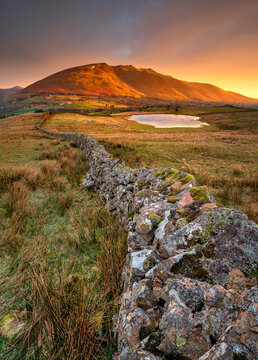 Bright Golden Sunrise Over Blencathra Mountain Tops In The English Lake District.