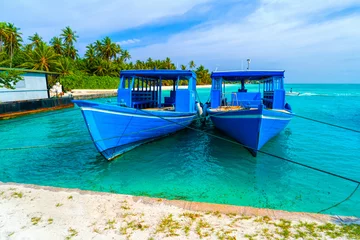 Foto op Plexiglas Yacht near the pier of a fabulous island in the Maldives. © lotosfoto