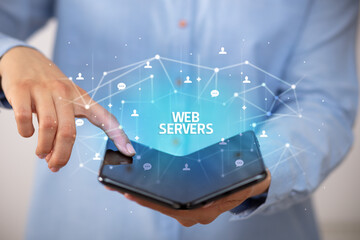 Businessman holding a foldable smartphone with WEB SERVERS inscription, new technology concept