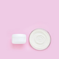 Collagen white powder. Pastel color background. Health product. Woman cosmetics concept. Sport supplement. Skincare cosmetics. Pink monochrome. Cream jar